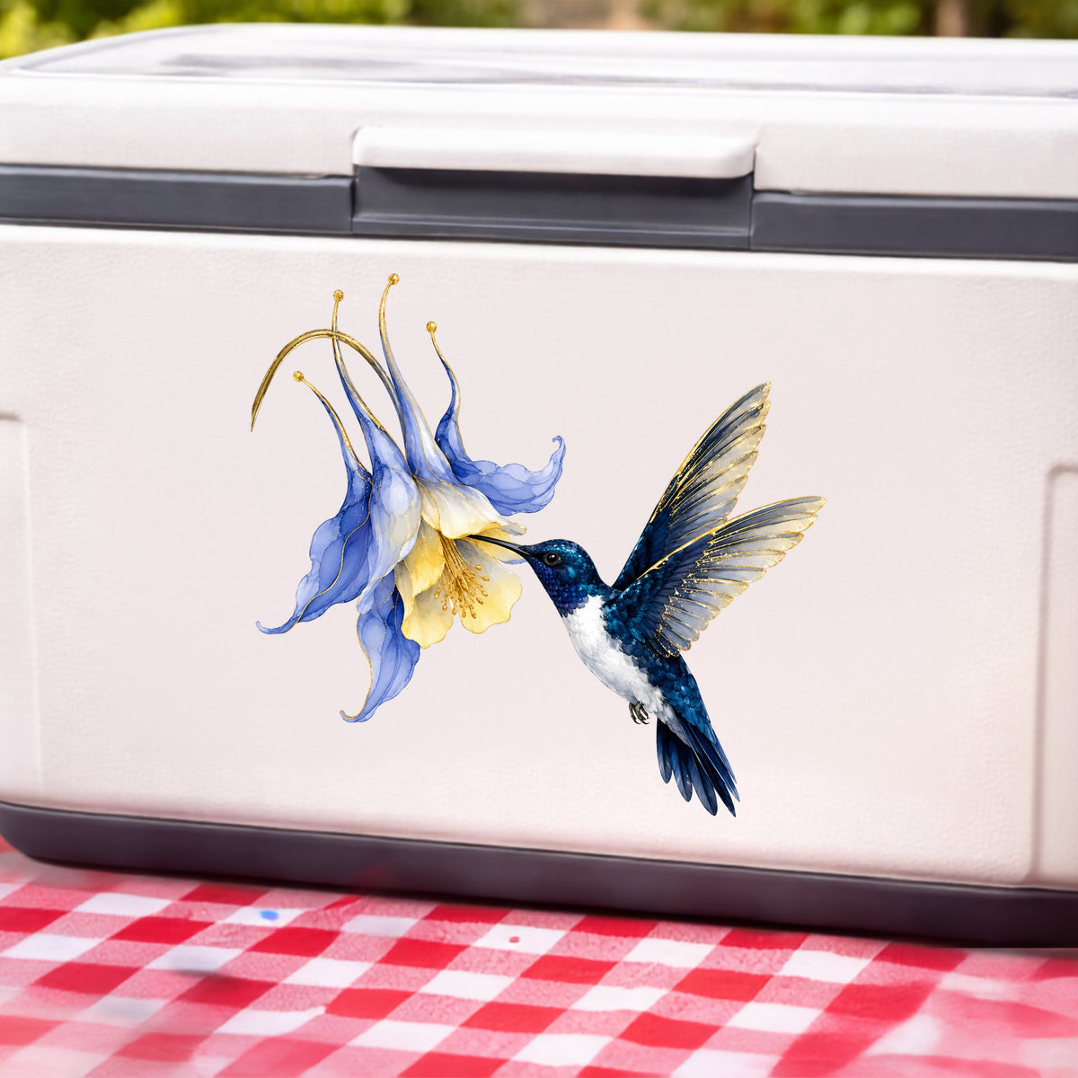 Navy Hummingbird Blue Columbine UV DTF sticker applied to a white cooler on a red gingham cloth