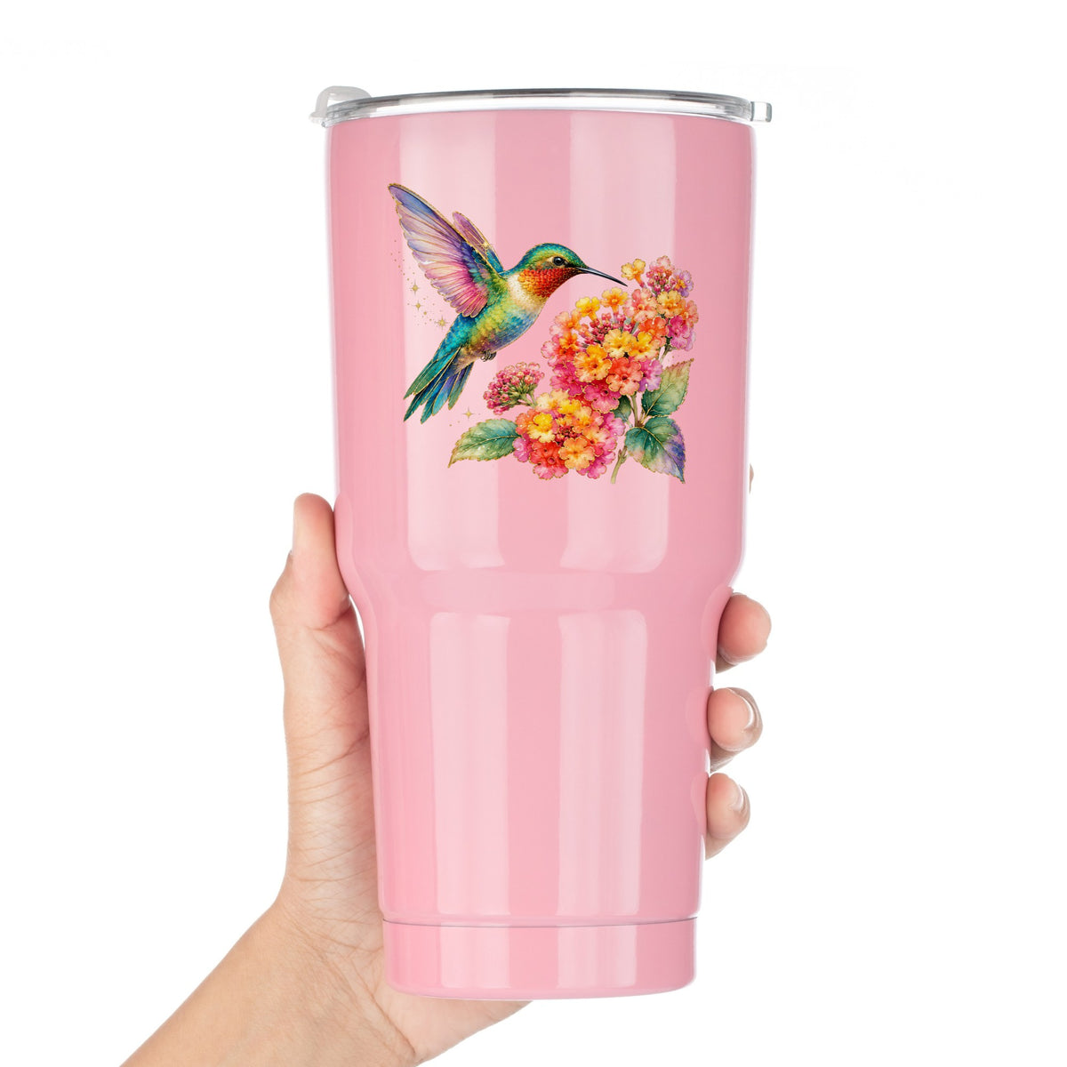 Rainbow Hummingbird Lantana UV DTF sticker applied to a pink tumbler held against a white background