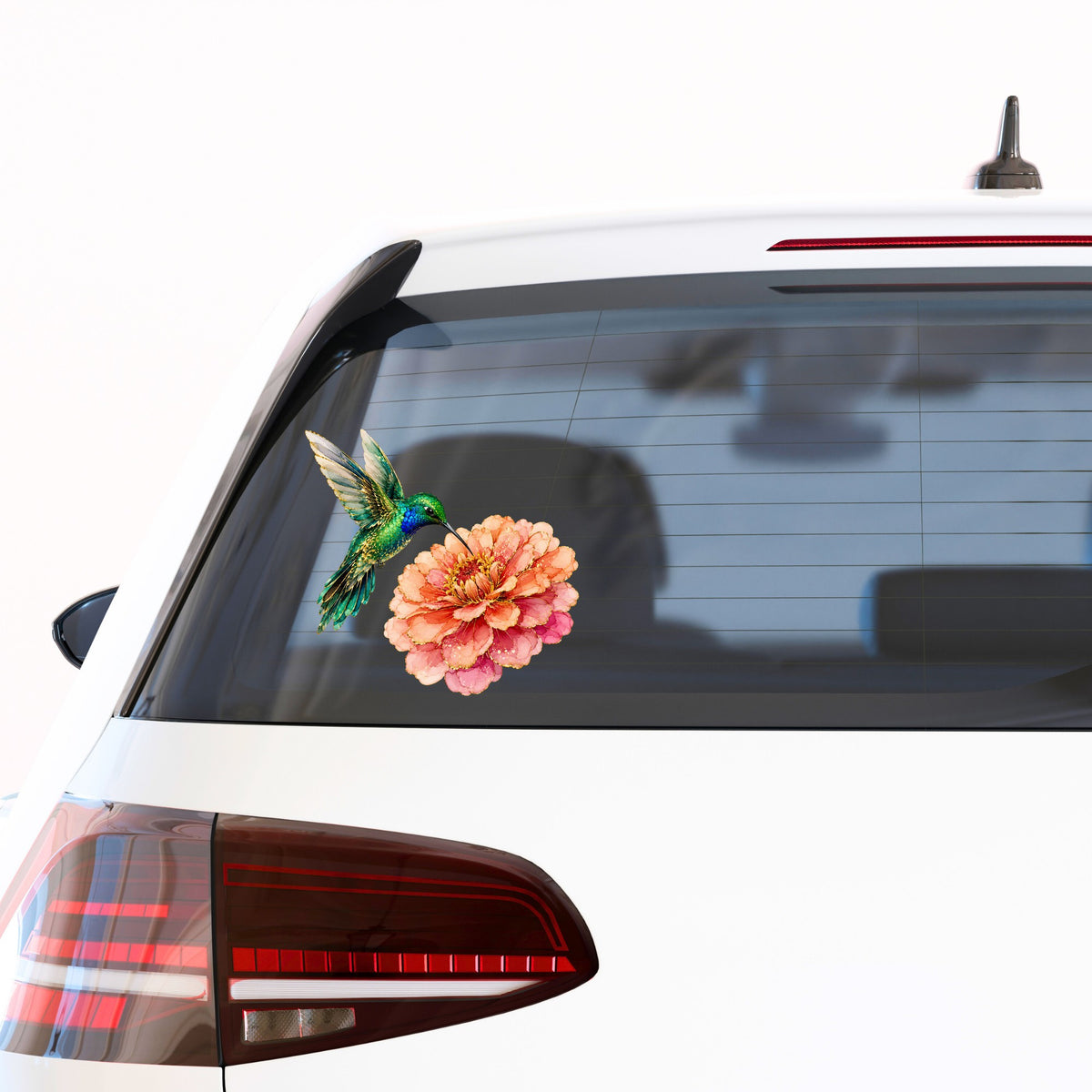 Hummingbird Coral Zinnia UV DTF sticker applied to the rear window of a white car