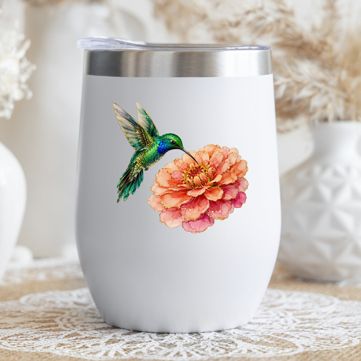 Hummingbird Coral Zinnia UV DTF sticker applied to a white stemless tumbler with a lid