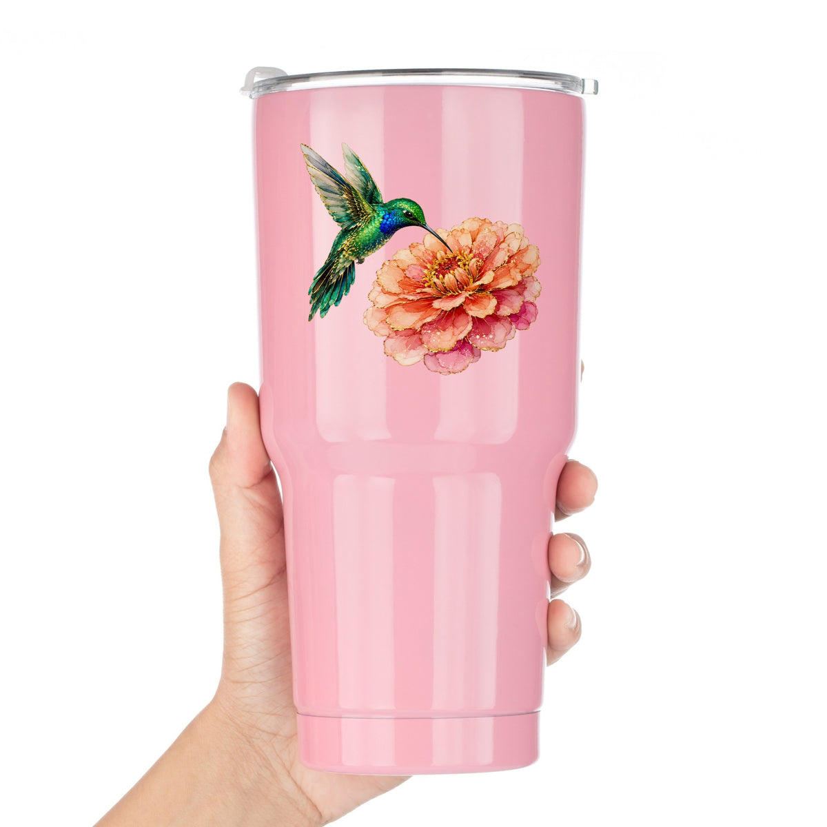 Hummingbird Coral Zinnia UV DTF sticker applied to a pink tumbler held against a white background
