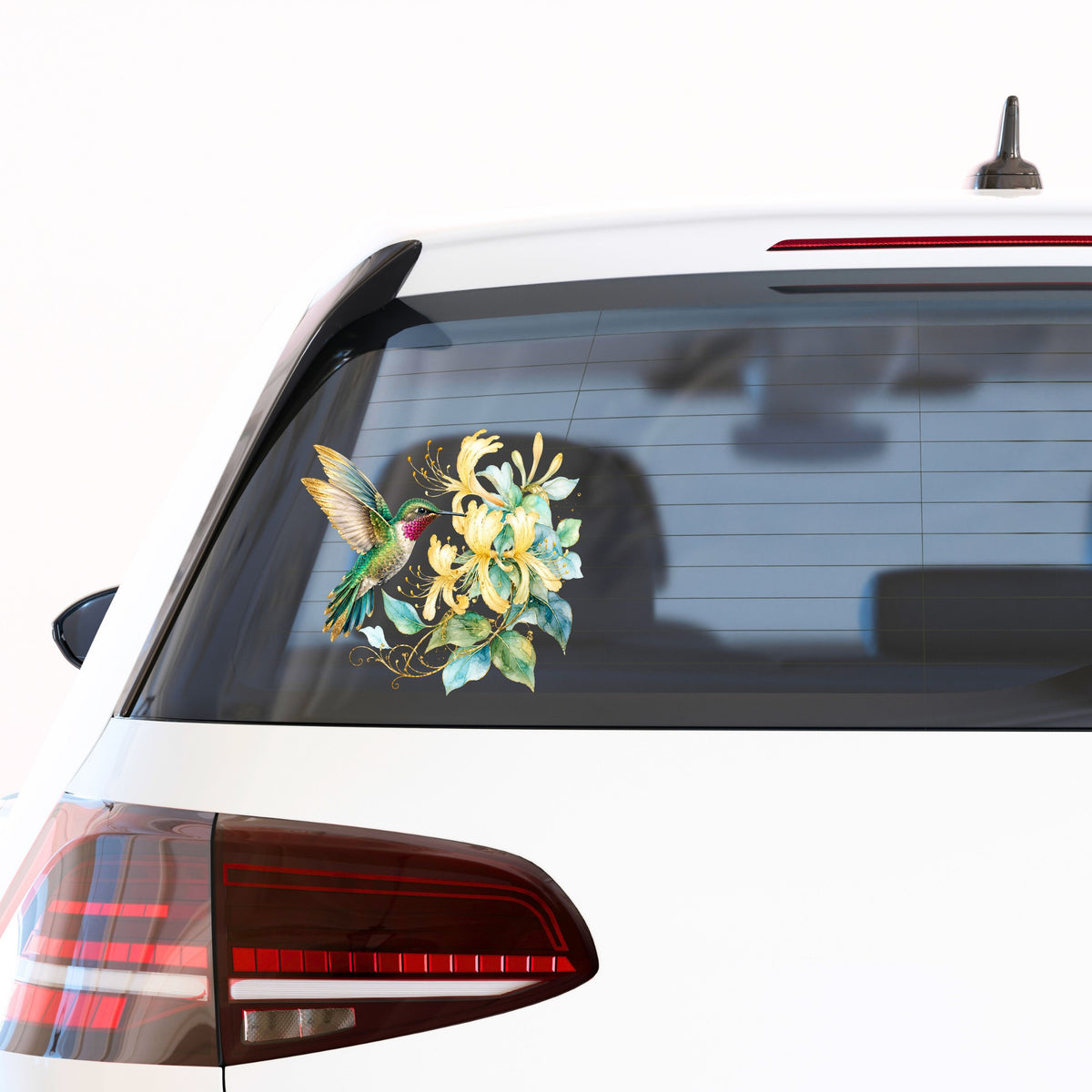 Hummingbird Yellow Honeysuckle UV DTF sticker applied to the rear window of a white car