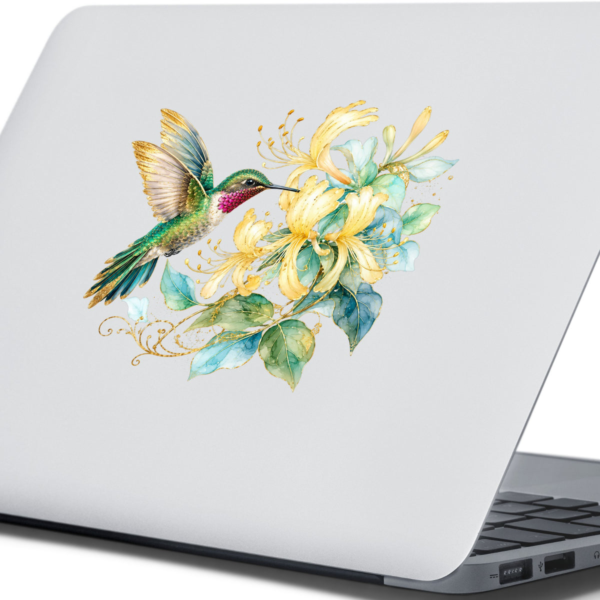 Hummingbird Yellow Honeysuckle UV DTF sticker applied to the lid of a silver laptop