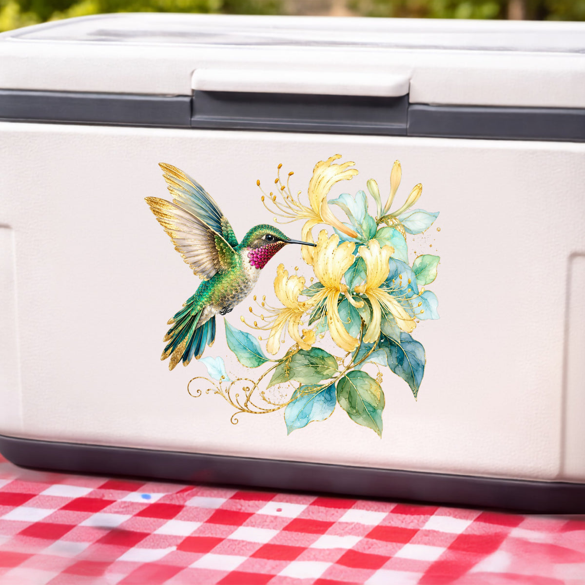 Hummingbird Yellow Honeysuckle UV DTF sticker applied to a white cooler on a red gingham cloth