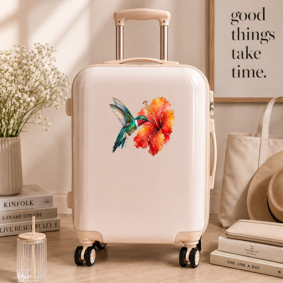 Hummingbird Red Hibiscus UV DTF sticker applied to a cream carry-on suitcase