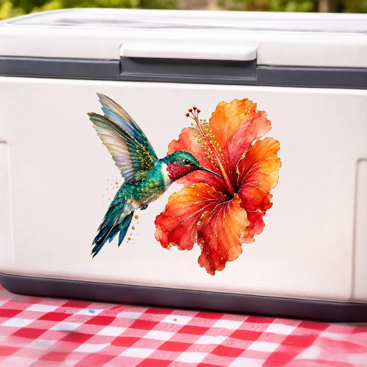 Hummingbird Red Hibiscus UV DTF sticker applied to a white cooler on a red gingham cloth