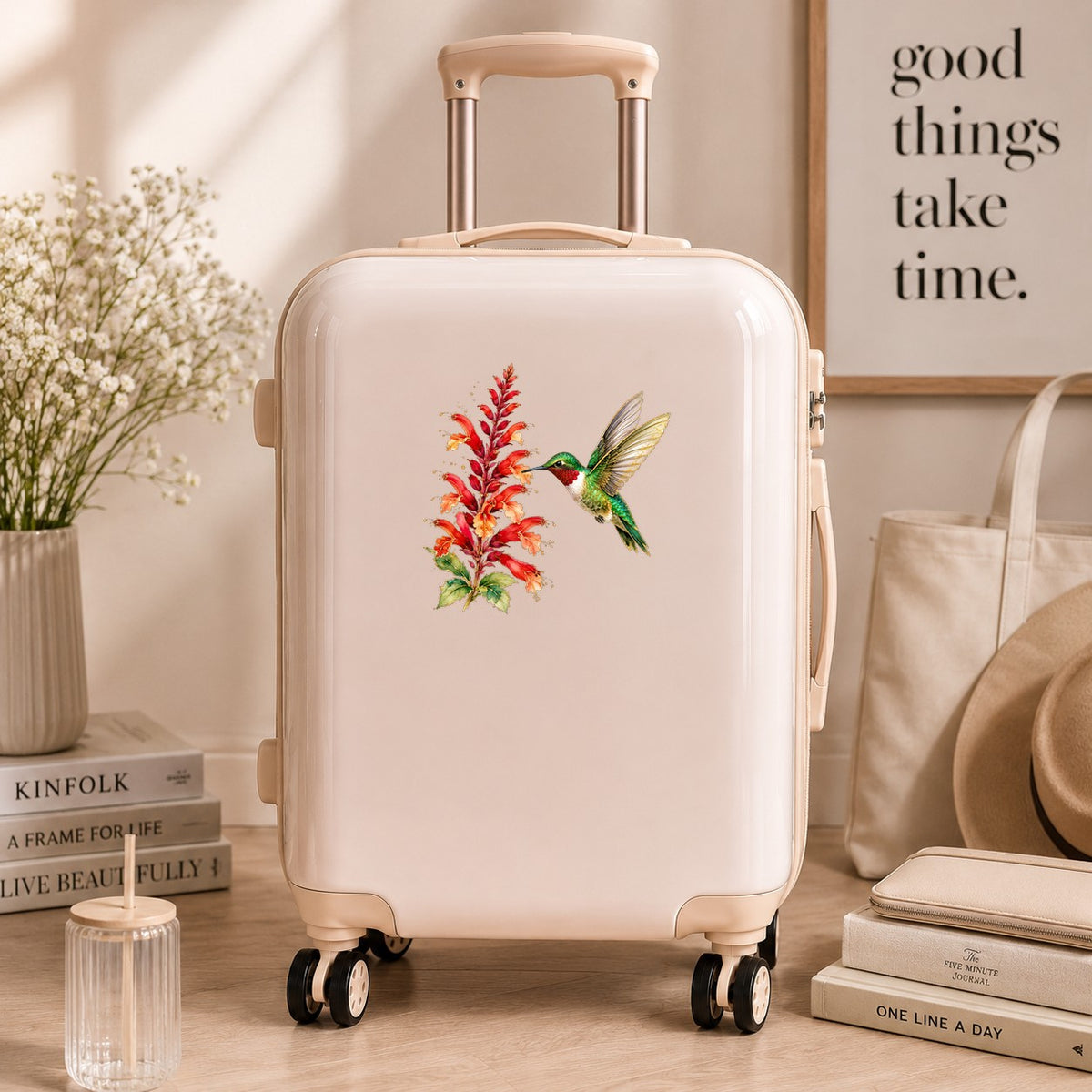 Hummingbird Red Salvia UV DTF sticker applied to a cream carry-on suitcase
