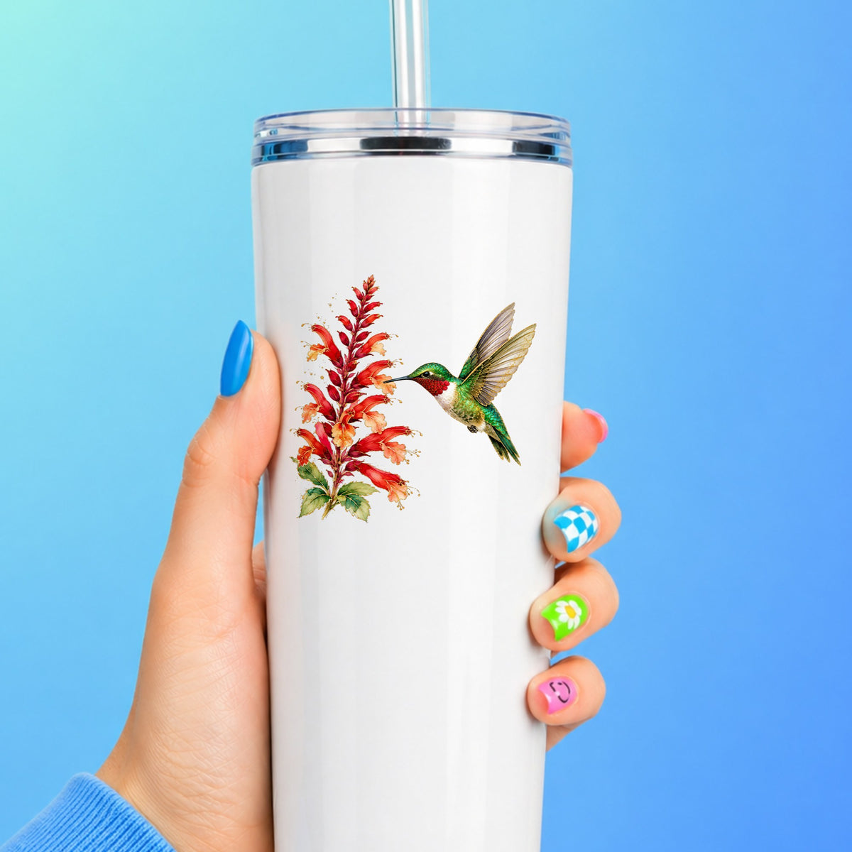 Hummingbird Red Salvia UV DTF sticker applied to a white straw tumbler on a blue background