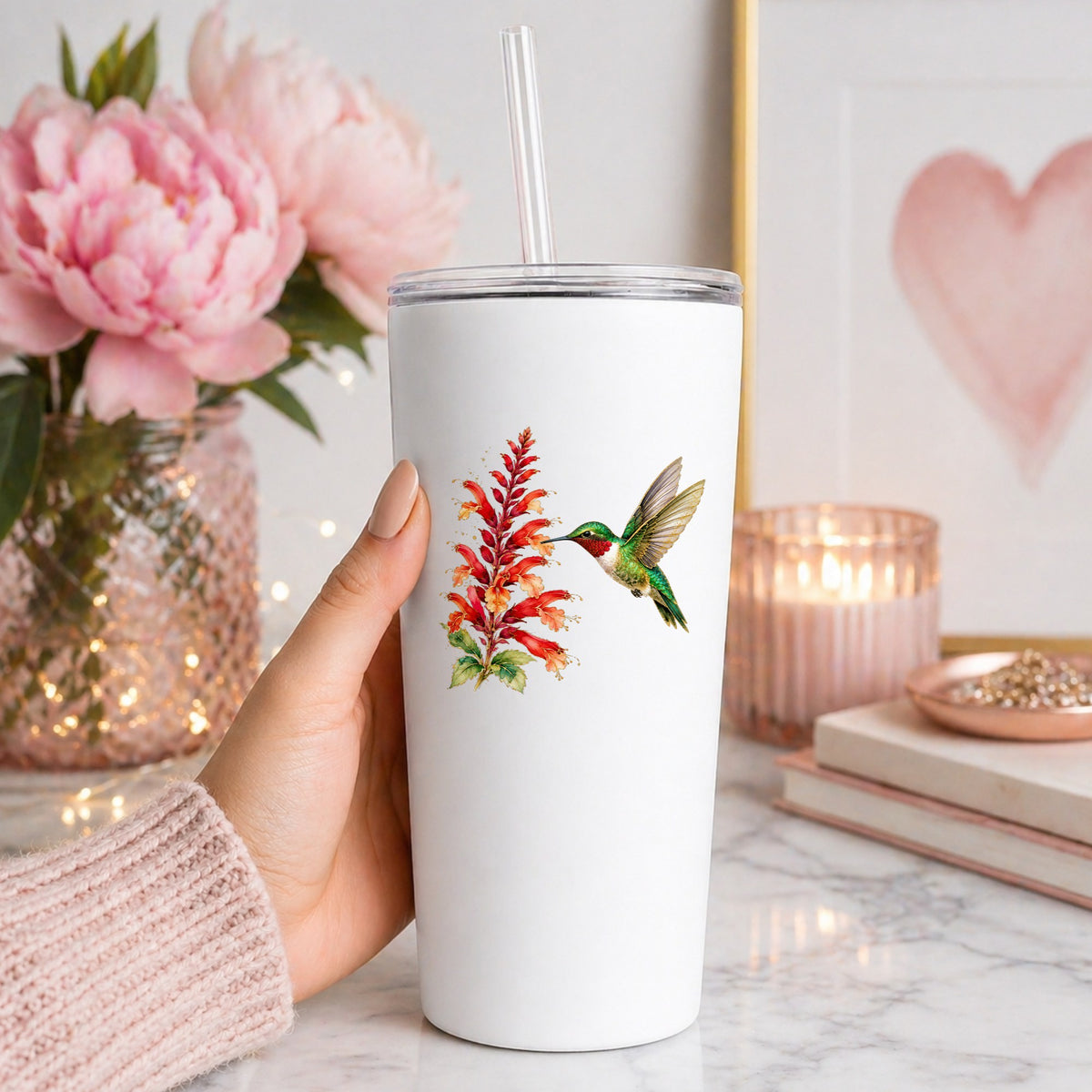Hummingbird Red Salvia UV DTF sticker applied to a white straw tumbler beside pink peonies