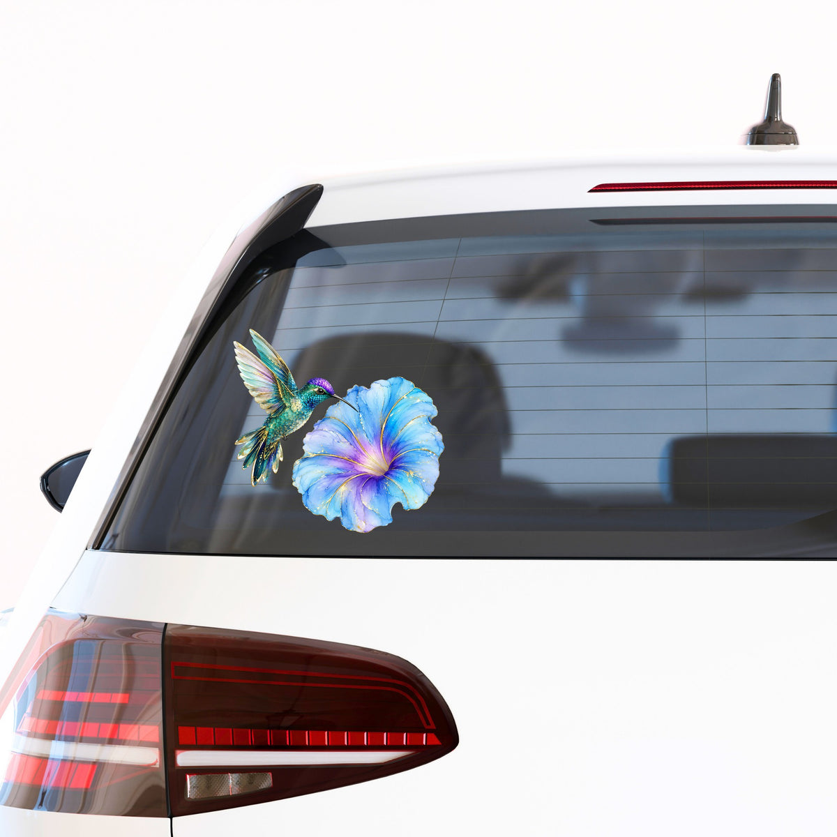 Teal Hummingbird Blue Morning Glory UV DTF sticker applied to the rear window of a white car