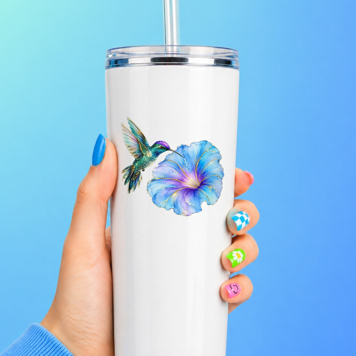 Teal Hummingbird Blue Morning Glory UV DTF sticker applied to a white straw tumbler on a blue background