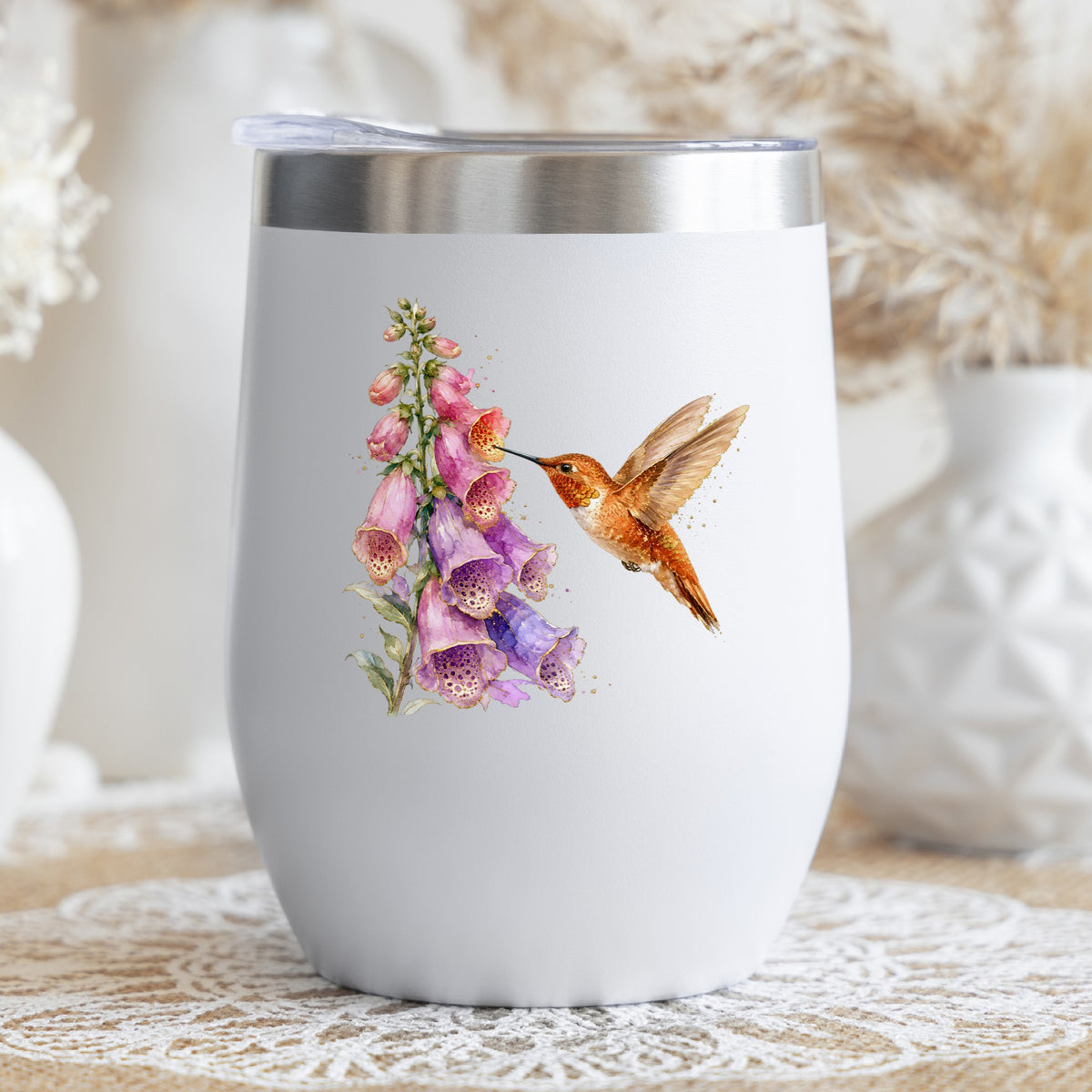 Rufous Hummingbird Pink Foxglove UV DTF sticker applied to a white stemless tumbler with a lid