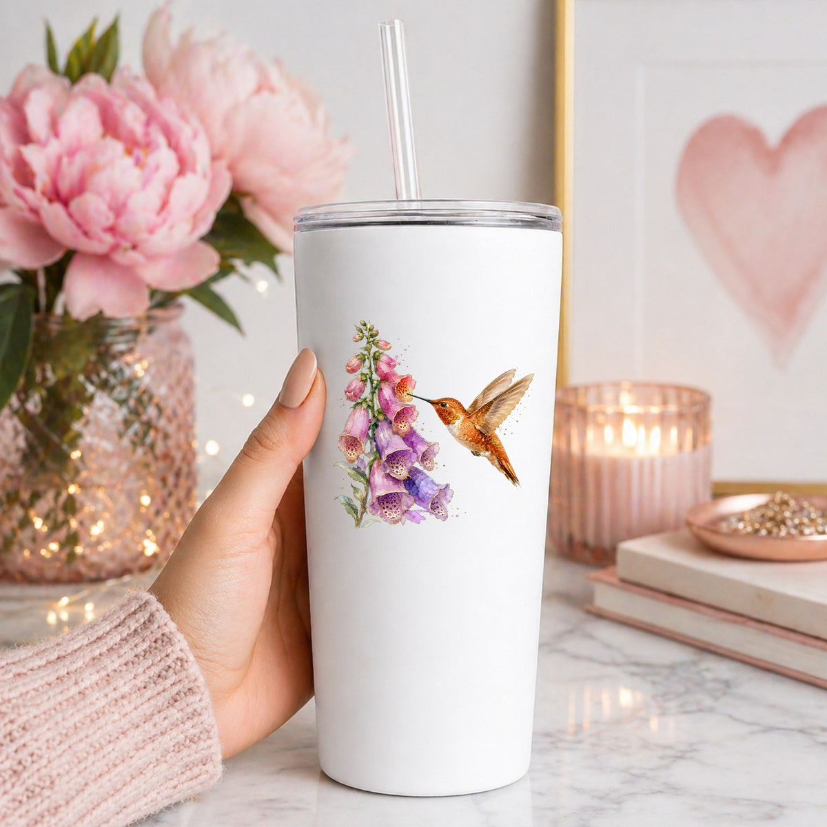 Rufous Hummingbird Pink Foxglove UV DTF sticker applied to a white straw tumbler beside pink peonies