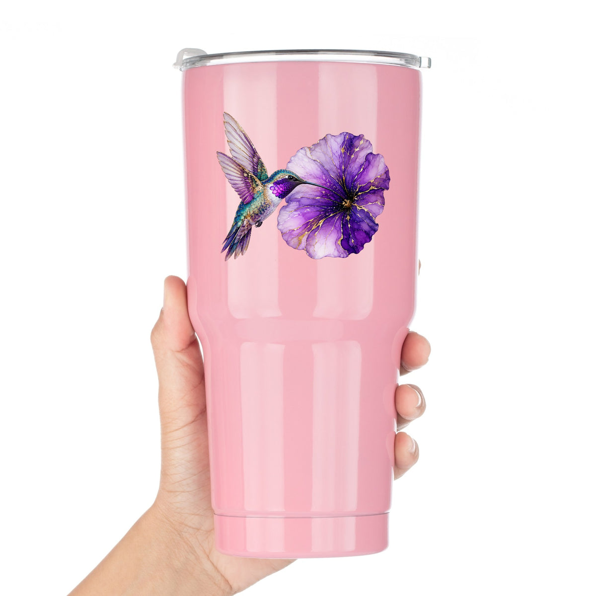 Hummingbird Purple Petunia UV DTF sticker applied to a pink tumbler held against a white background