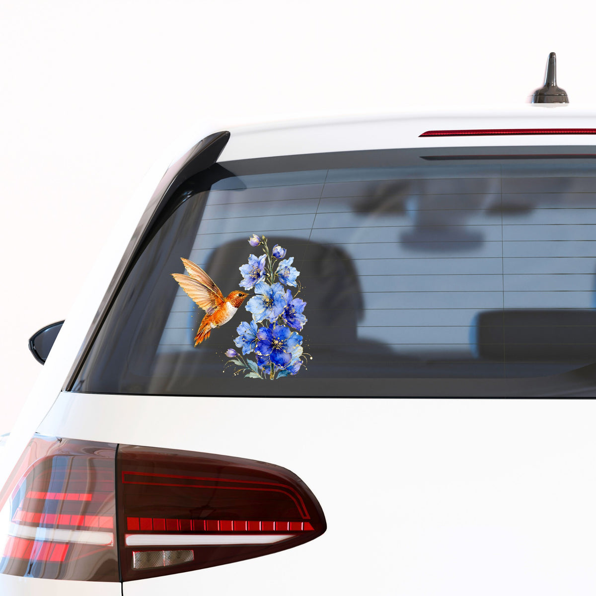 Rufous Hummingbird Blue Delphinium UV DTF sticker applied to the rear window of a white car