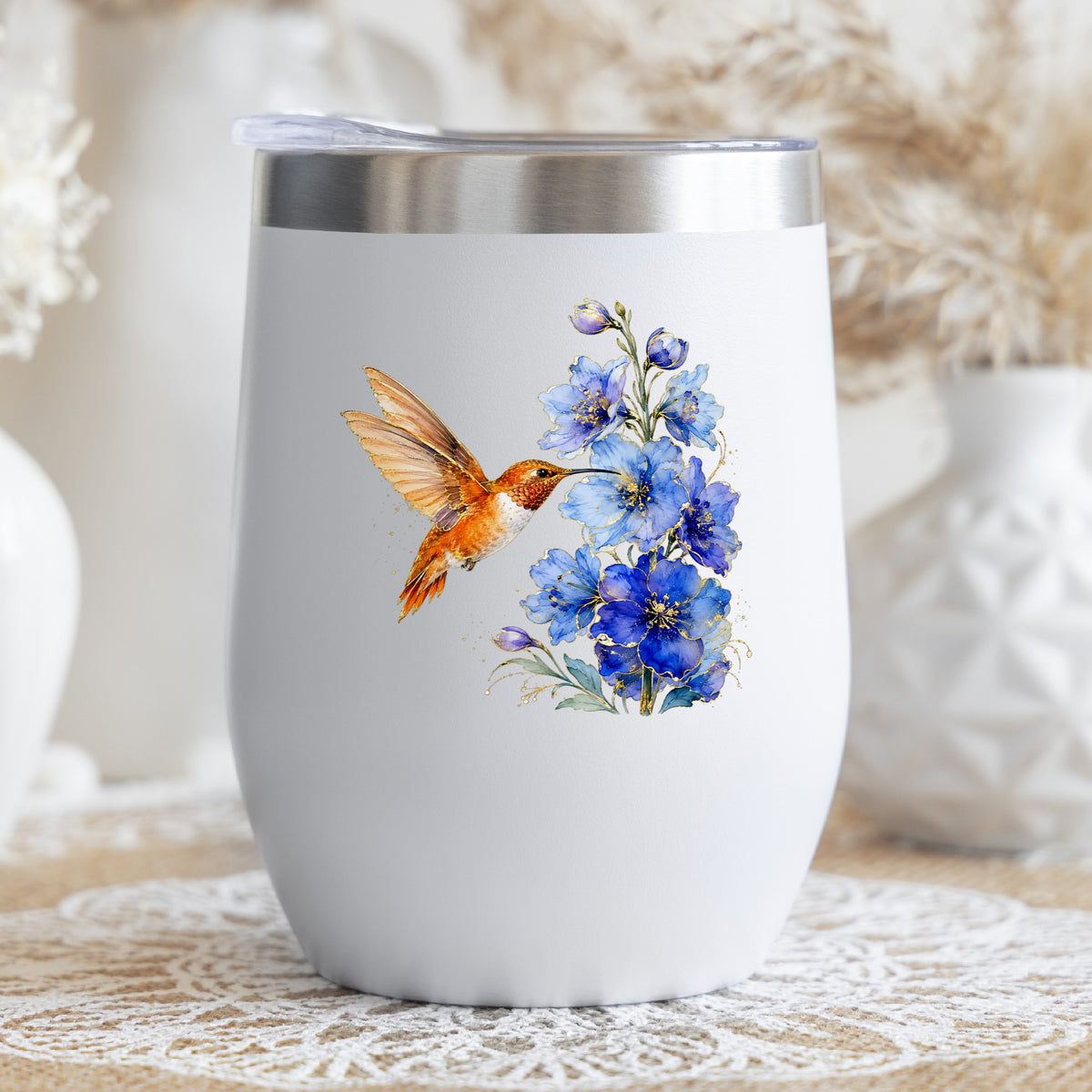Rufous Hummingbird Blue Delphinium UV DTF sticker applied to a white stemless tumbler with a lid
