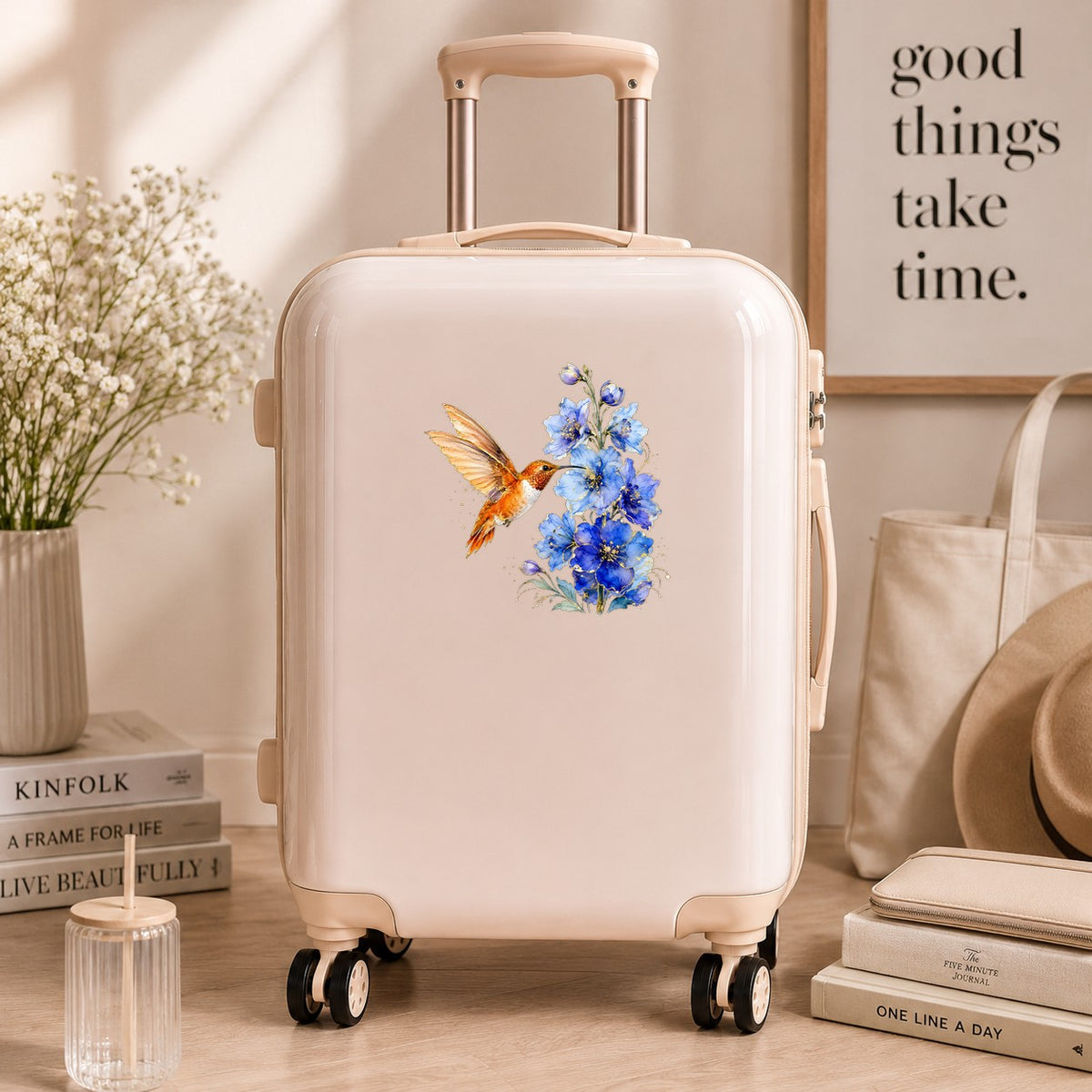 Rufous Hummingbird Blue Delphinium UV DTF sticker applied to a cream carry-on suitcase