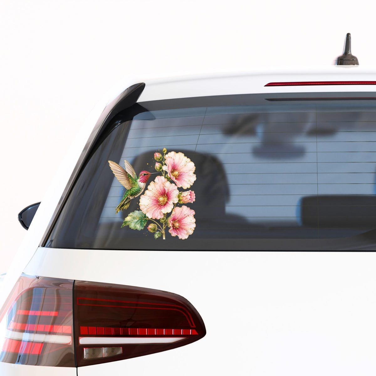 Hummingbird Pink Hollyhock UV DTF sticker applied to the rear window of a white car