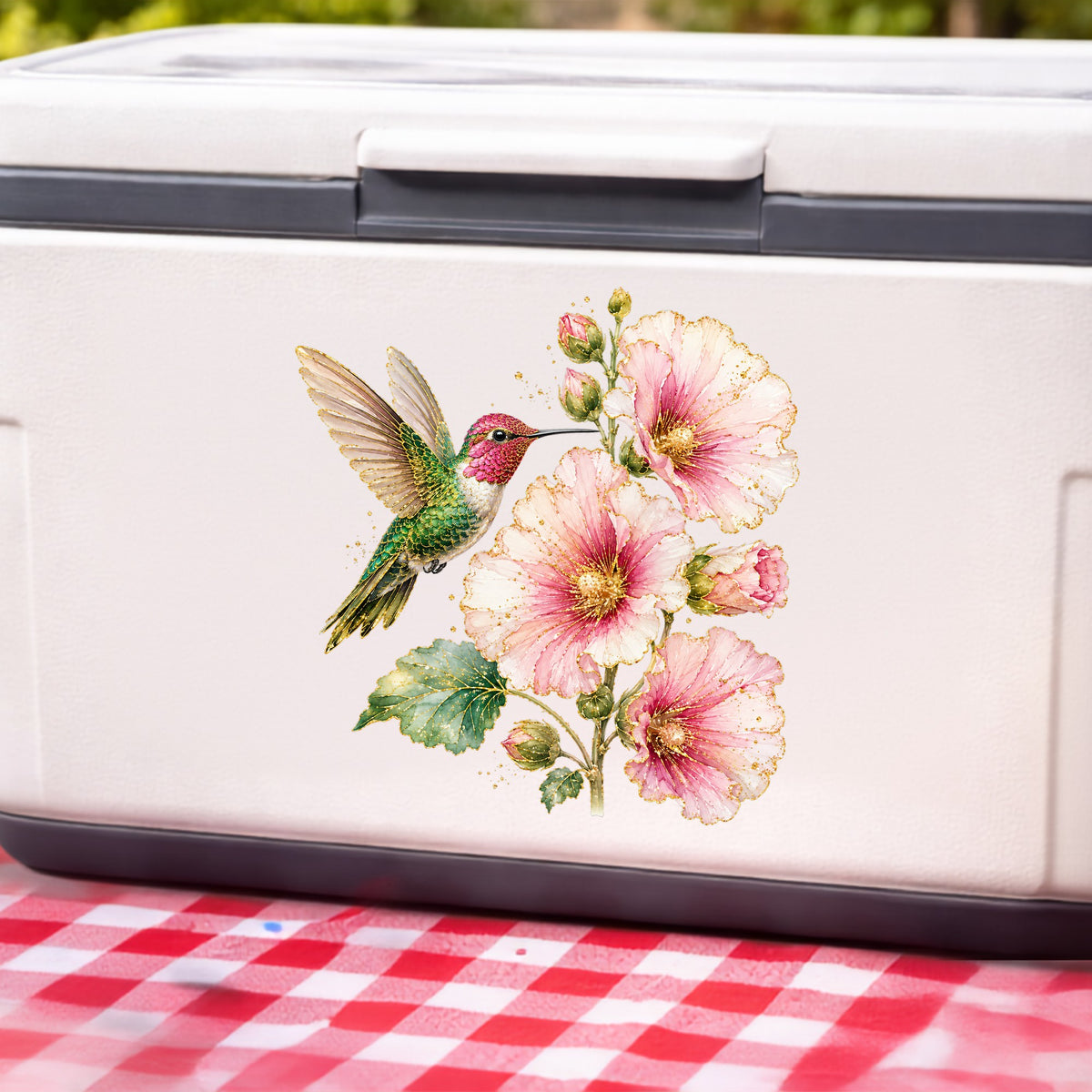 Hummingbird Pink Hollyhock UV DTF sticker applied to a white cooler on a red gingham cloth