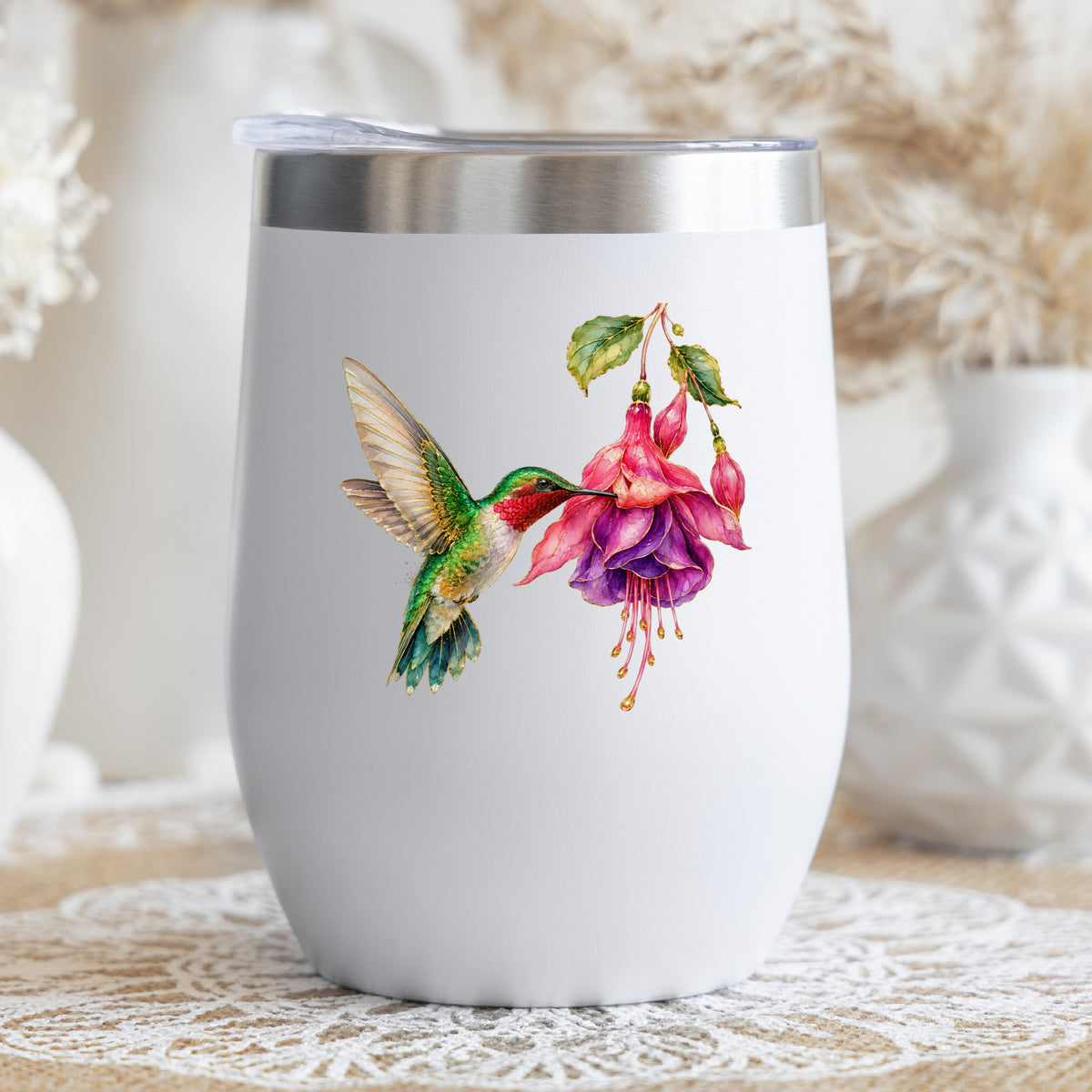 Hummingbird Fuchsia Flower UV DTF sticker applied to a white stemless tumbler with a lid