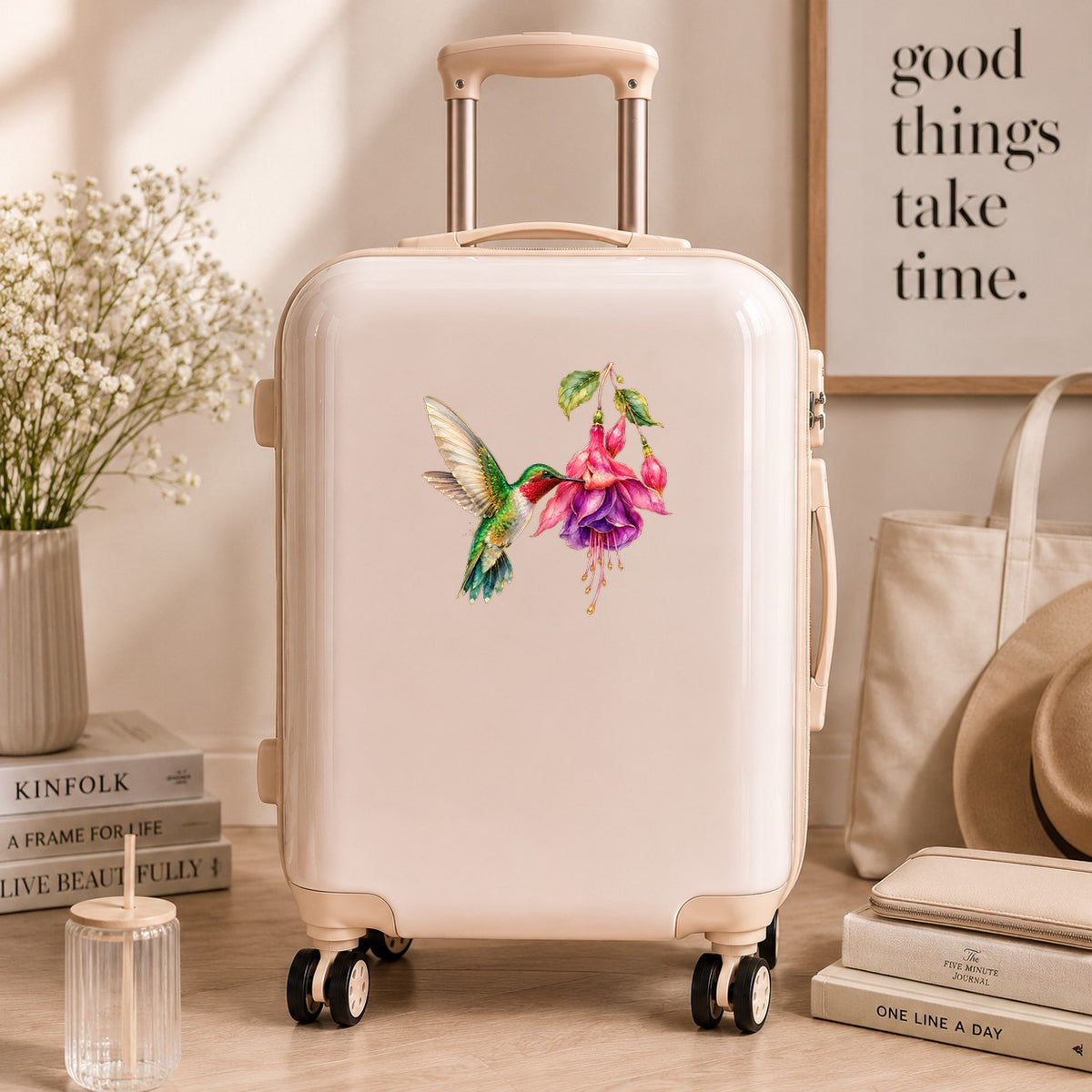 Hummingbird Fuchsia Flower UV DTF sticker applied to a cream carry-on suitcase