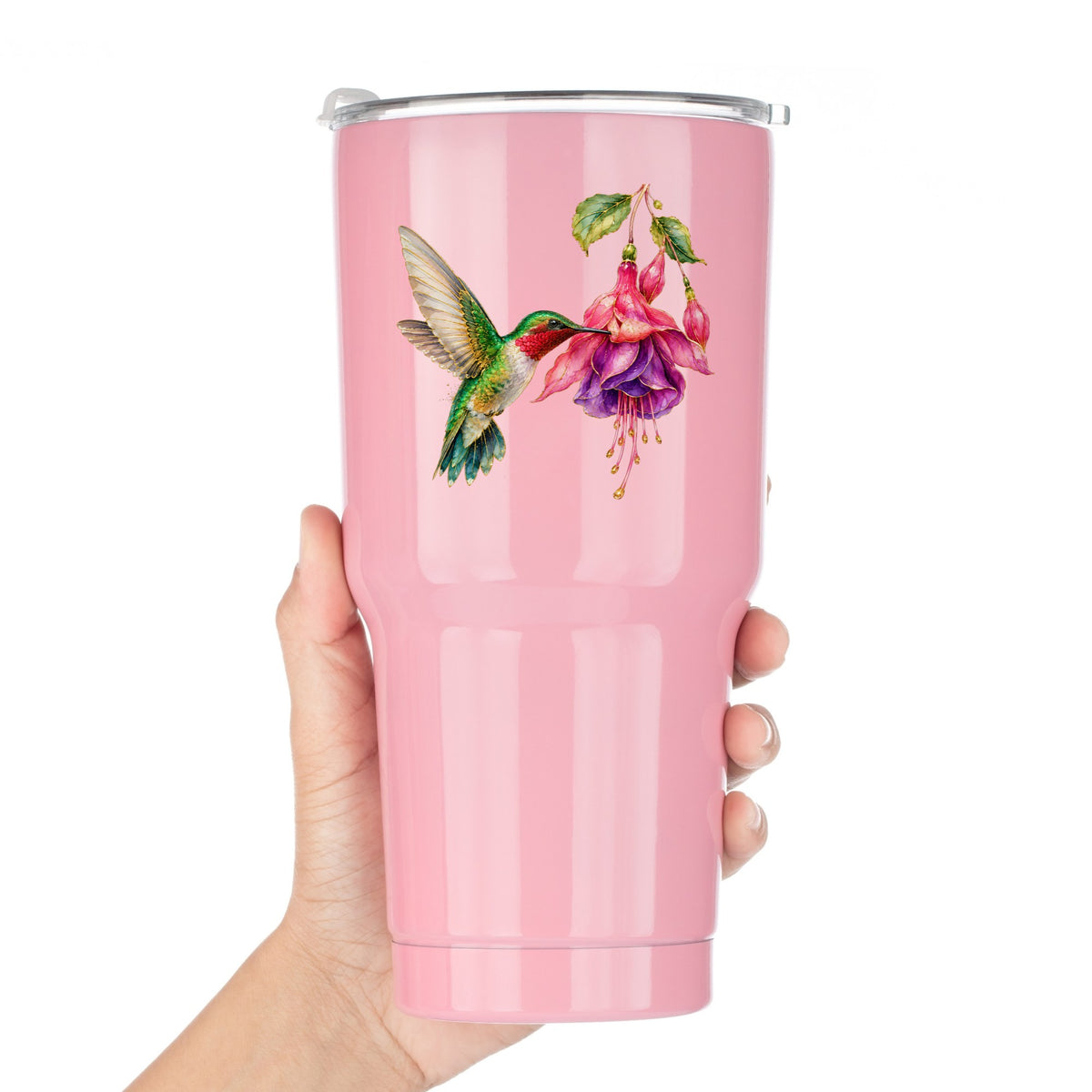 Hummingbird Fuchsia Flower UV DTF sticker applied to a pink tumbler held against a white background