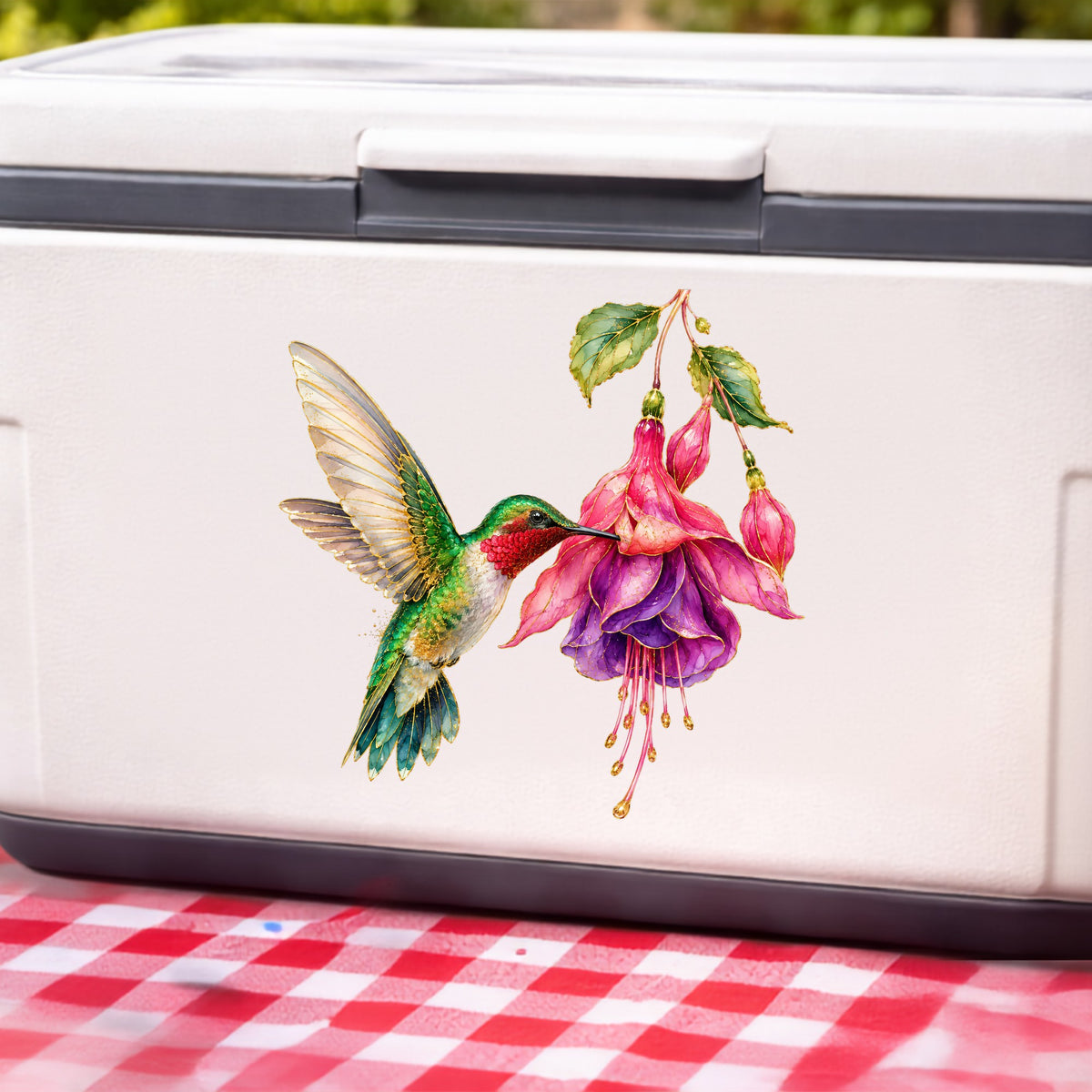 Hummingbird Fuchsia Flower UV DTF sticker applied to a white cooler on a red gingham cloth