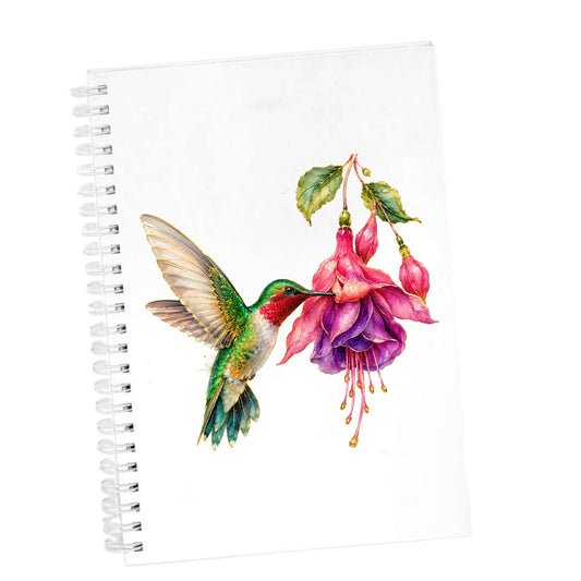 Hummingbird Fuchsia Flower UV DTF sticker applied to the cover of a white spiral journal