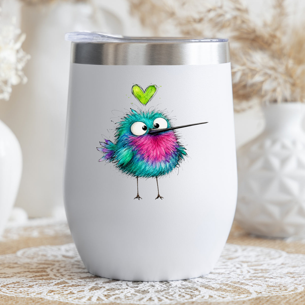 Fluffy Teal Pink Hummingbird UV DTF sticker applied to a white stemless tumbler with a lid