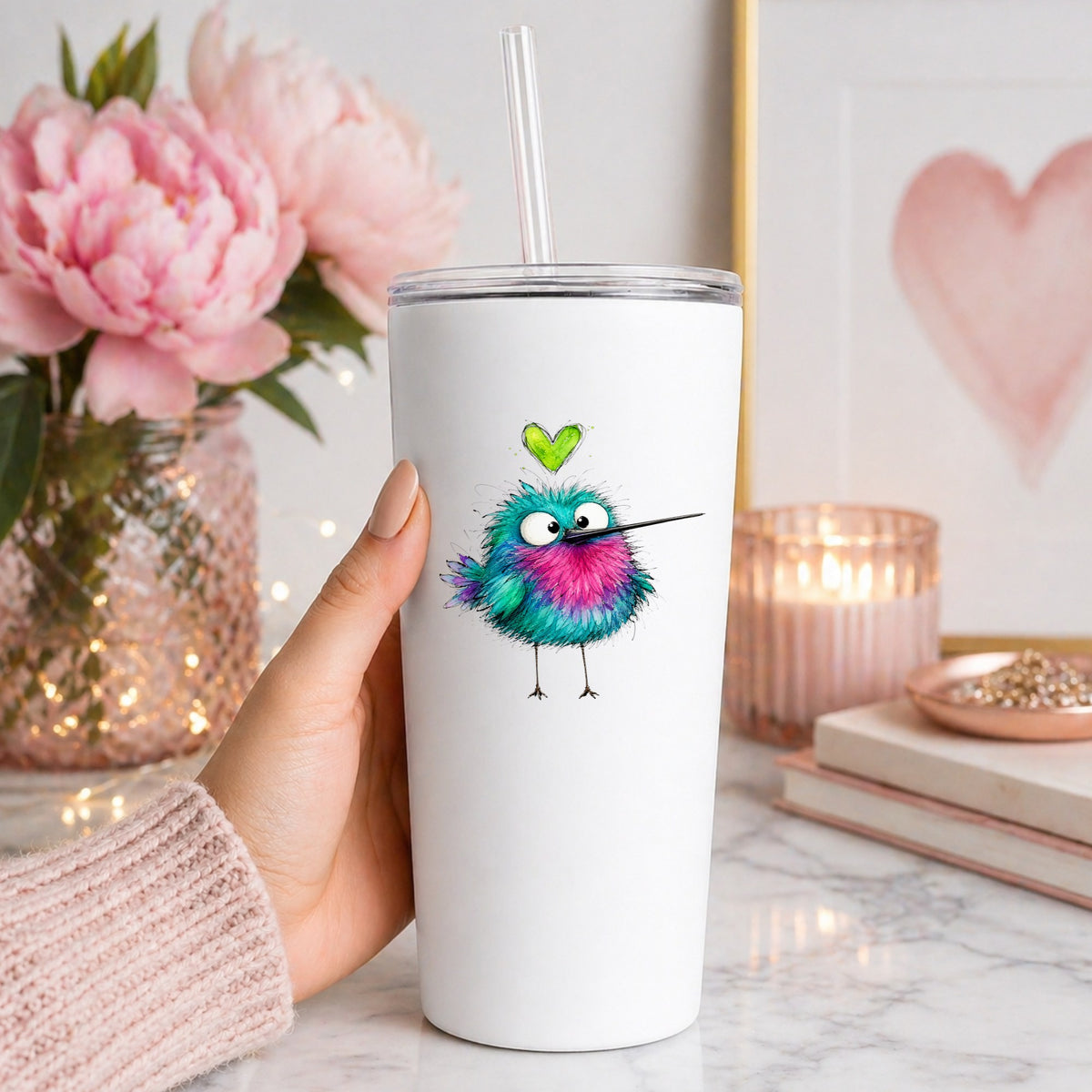Fluffy Teal Pink Hummingbird UV DTF sticker applied to a white straw tumbler beside pink peonies