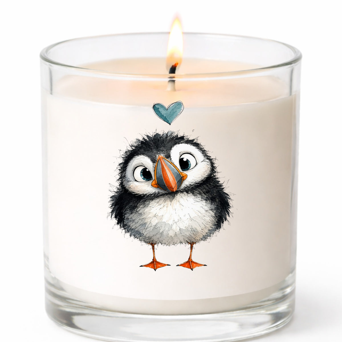 Funny Puffin UV DTF sticker applied to a white candle in a clear glass jar