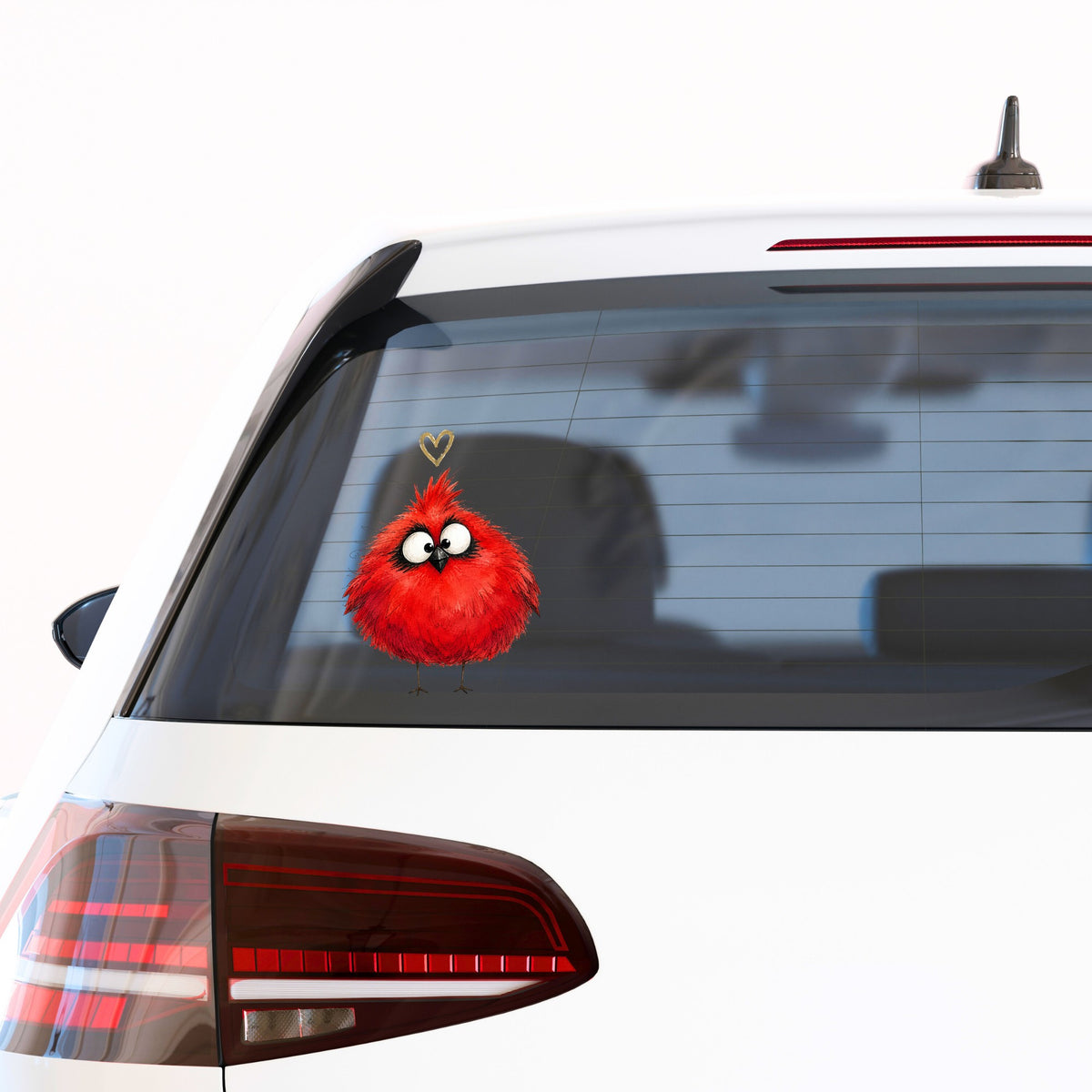 Fluffy Red Cardinal UV DTF sticker applied to the rear window of a white car