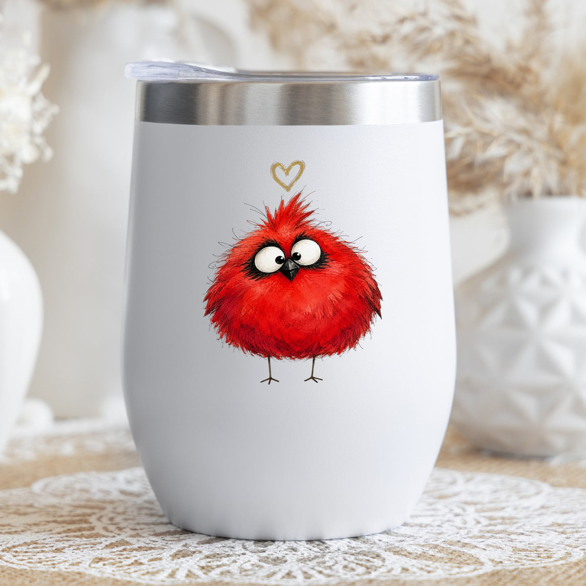 Fluffy Red Cardinal UV DTF sticker applied to a white stemless tumbler with a lid
