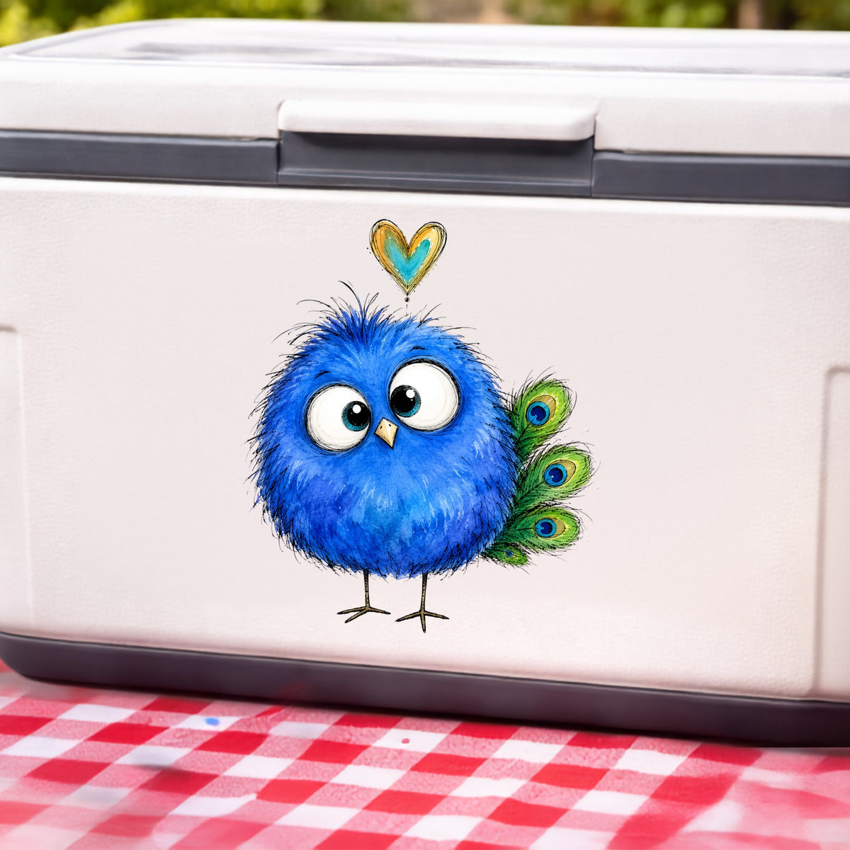 Funny Blue Peacock UV DTF sticker applied to a white cooler on a red gingham cloth