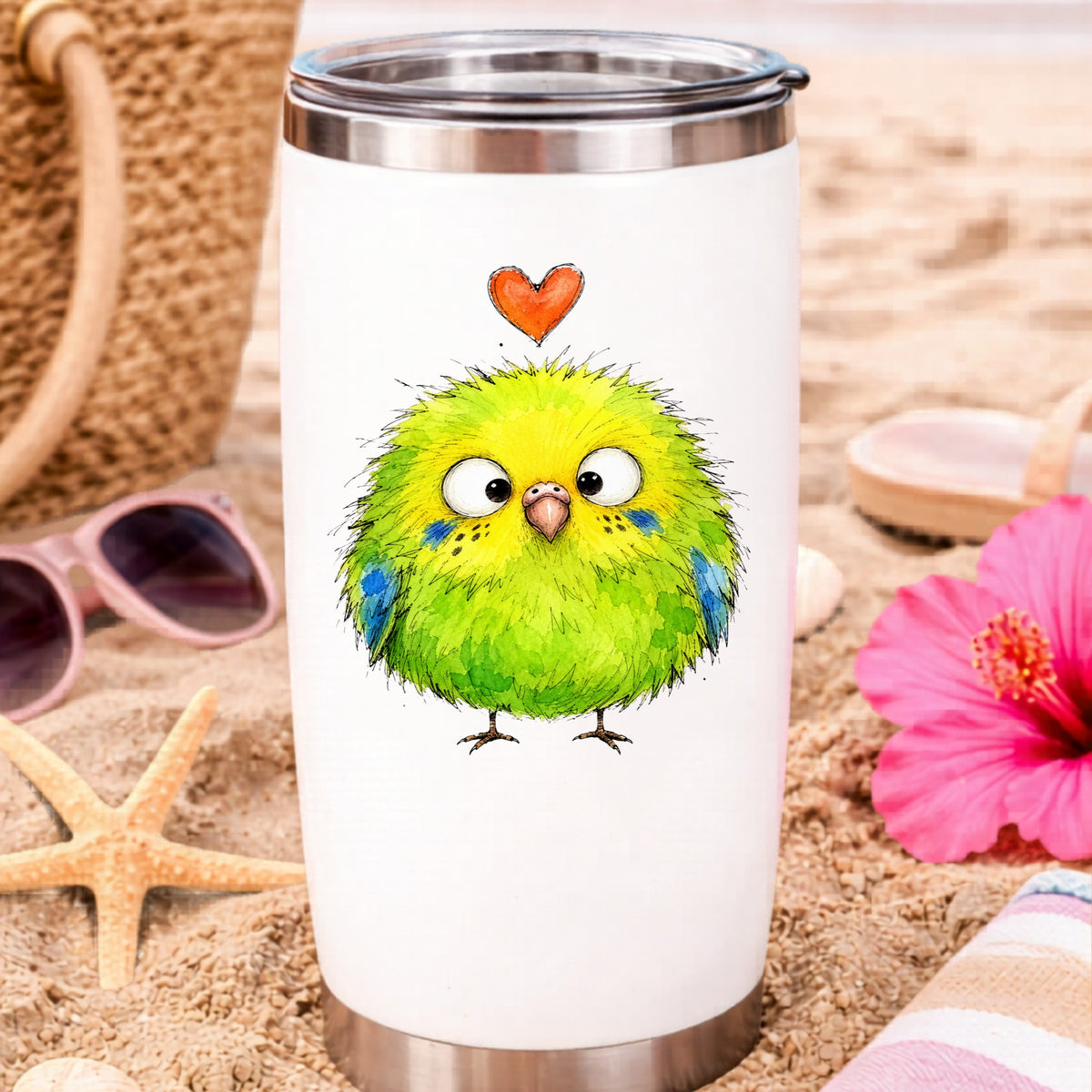 Fluffy Green Parakeet UV DTF sticker applied to a white travel tumbler on beach sand