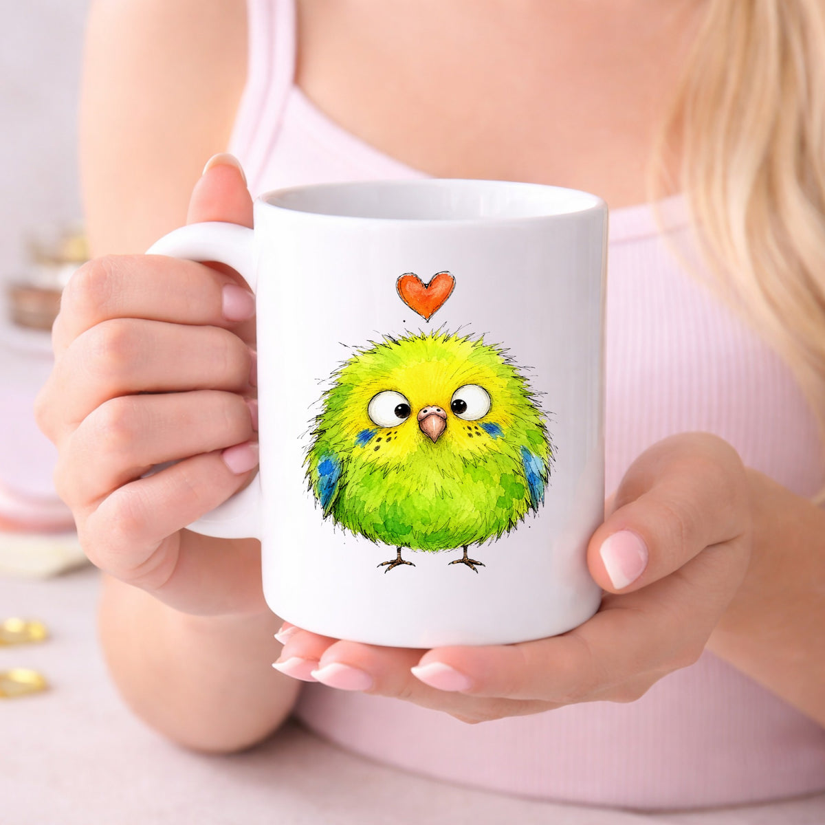 Fluffy Green Parakeet UV DTF sticker applied to a white coffee mug held in both hands