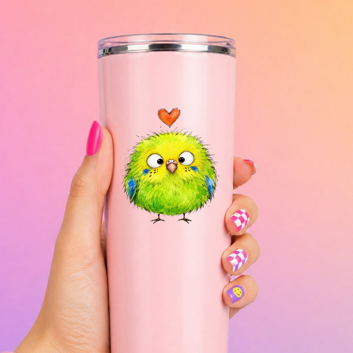 Fluffy Green Parakeet UV DTF sticker applied to a tall pink tumbler on a pink and orange background