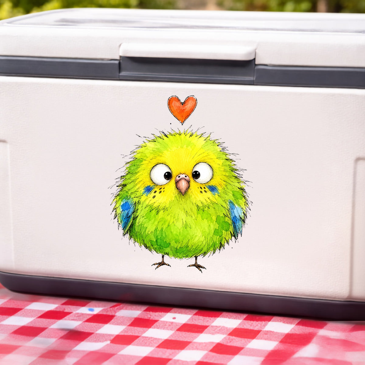 Fluffy Green Parakeet UV DTF sticker applied to a white cooler on a red gingham cloth