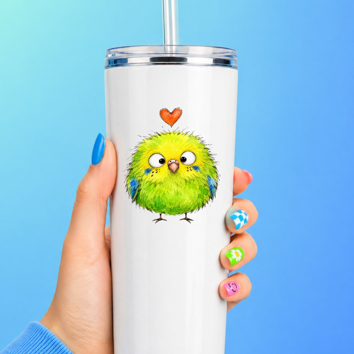Fluffy Green Parakeet UV DTF sticker applied to a white straw tumbler on a blue background