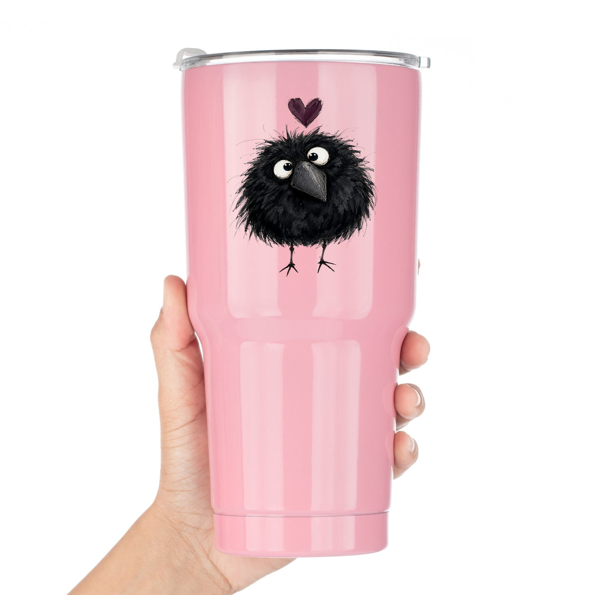 Fluffy Black Crow UV DTF sticker applied to a pink tumbler held against a white background