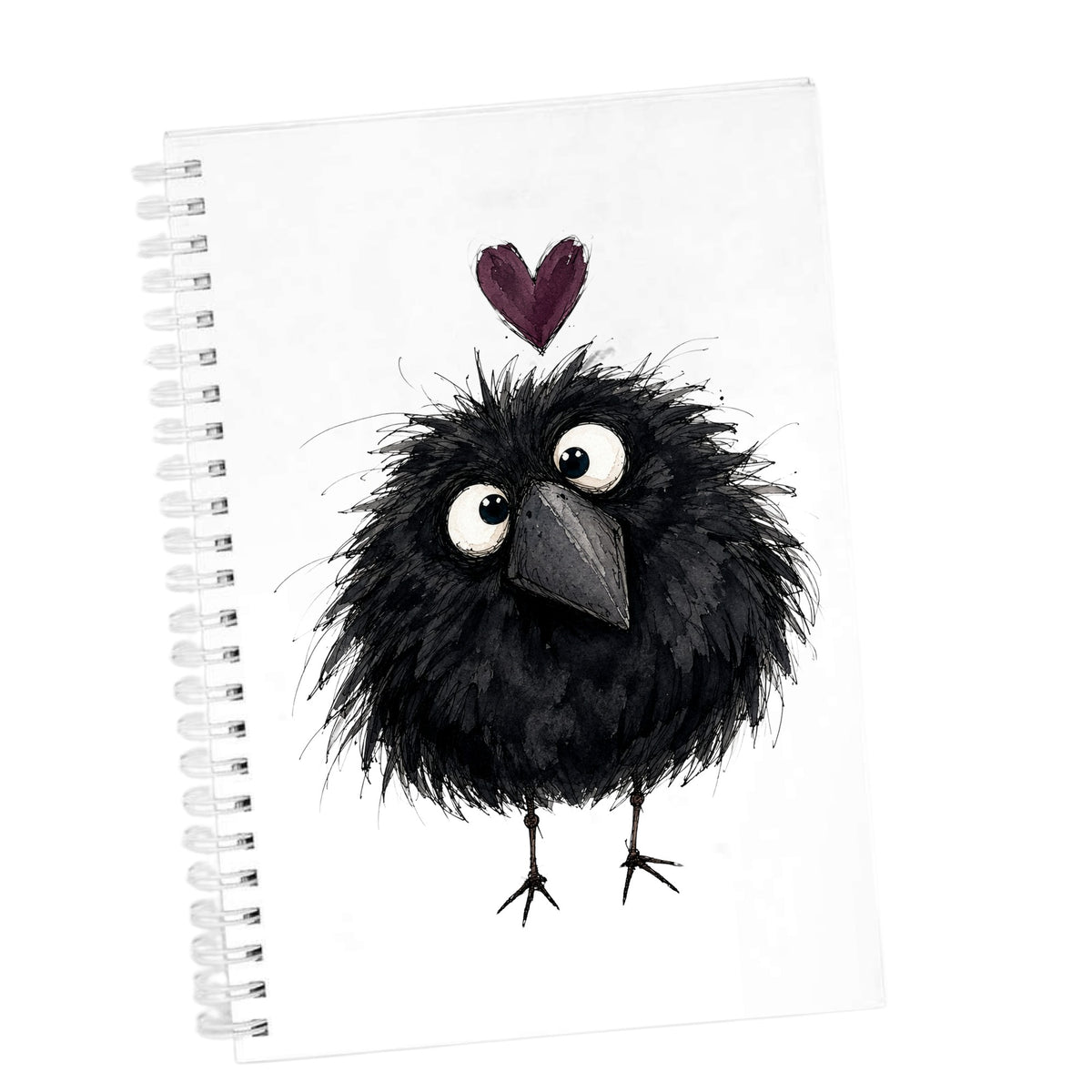 Fluffy Black Crow UV DTF sticker applied to the cover of a white spiral journal