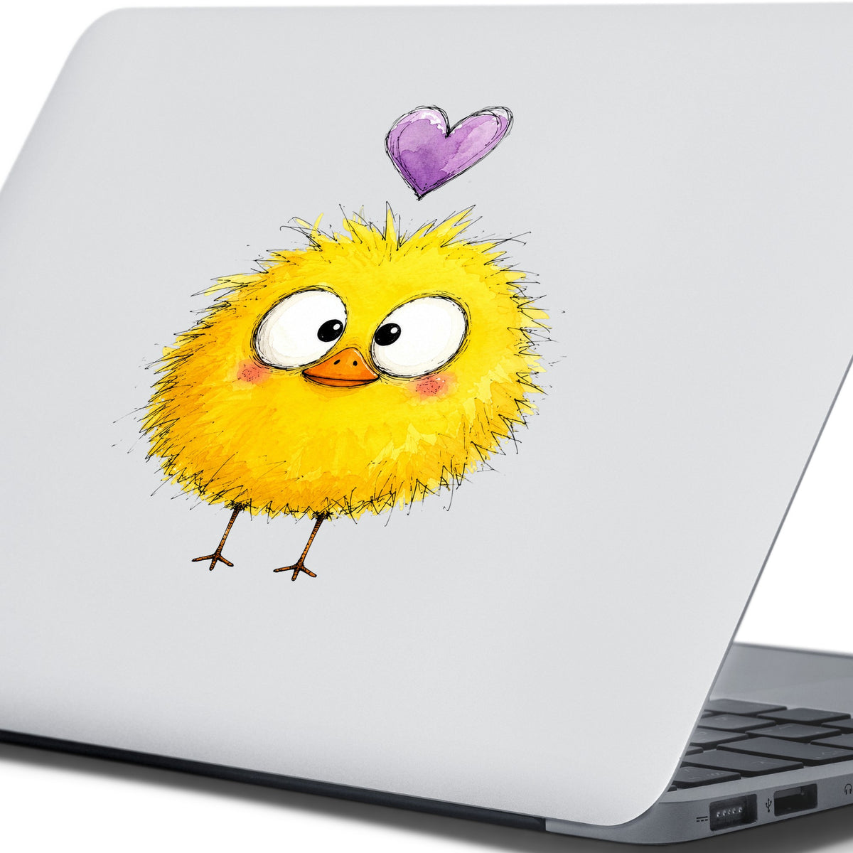 Fluffy Yellow Duckling UV DTF sticker applied to the lid of a silver laptop