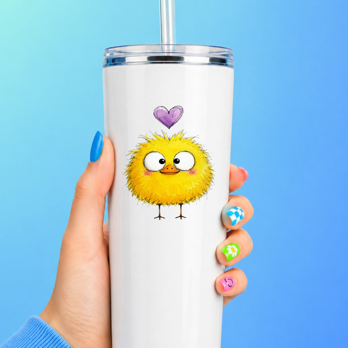 Fluffy Yellow Duckling UV DTF sticker applied to a white straw tumbler on a blue background