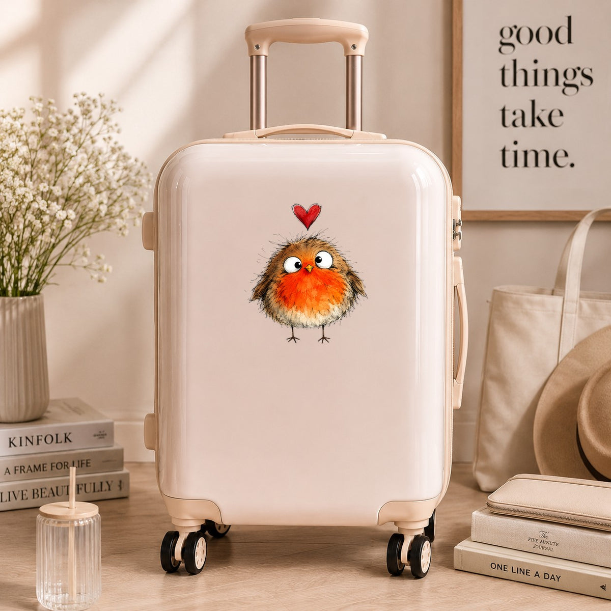 Fluffy Robin UV DTF sticker applied to a cream carry-on suitcase