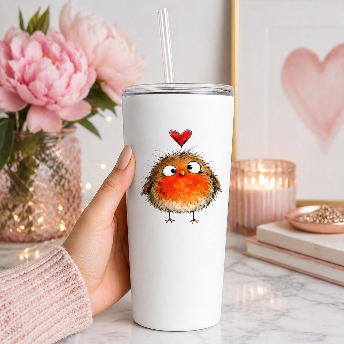 Fluffy Robin UV DTF sticker applied to a white straw tumbler beside pink peonies