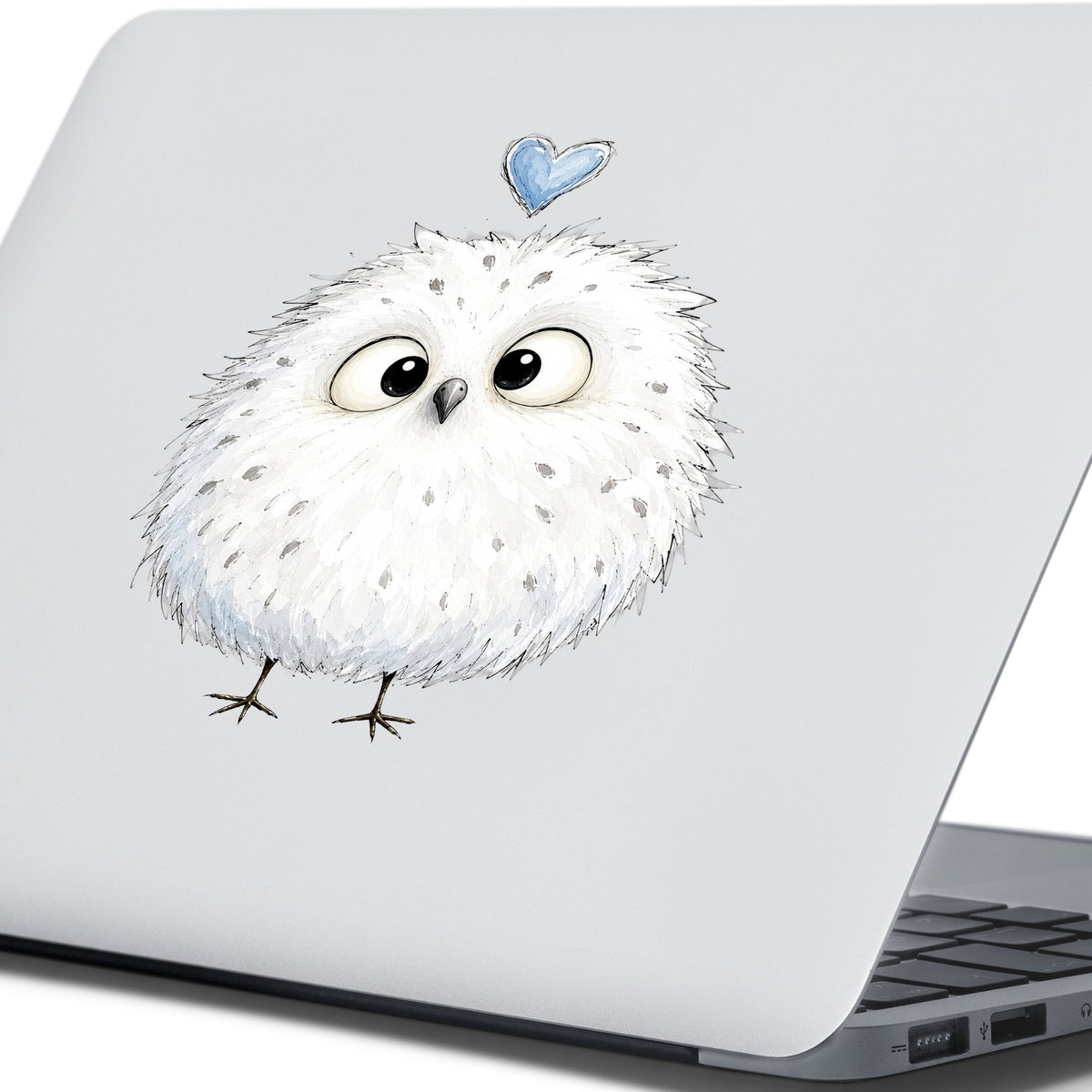 Fluffy White Owl UV DTF sticker applied to the lid of a silver laptop