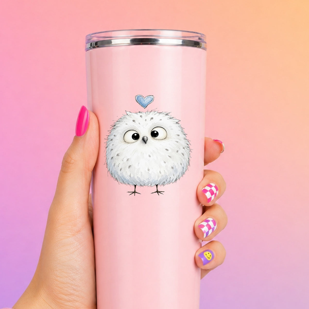 Fluffy White Owl UV DTF sticker applied to a tall pink tumbler on a pink and orange background