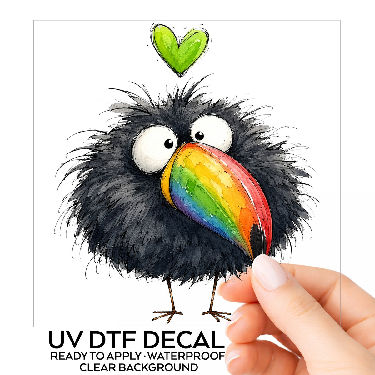 Funny Toucan Rainbow Beak UV DTF sticker on its backing card, held in hand