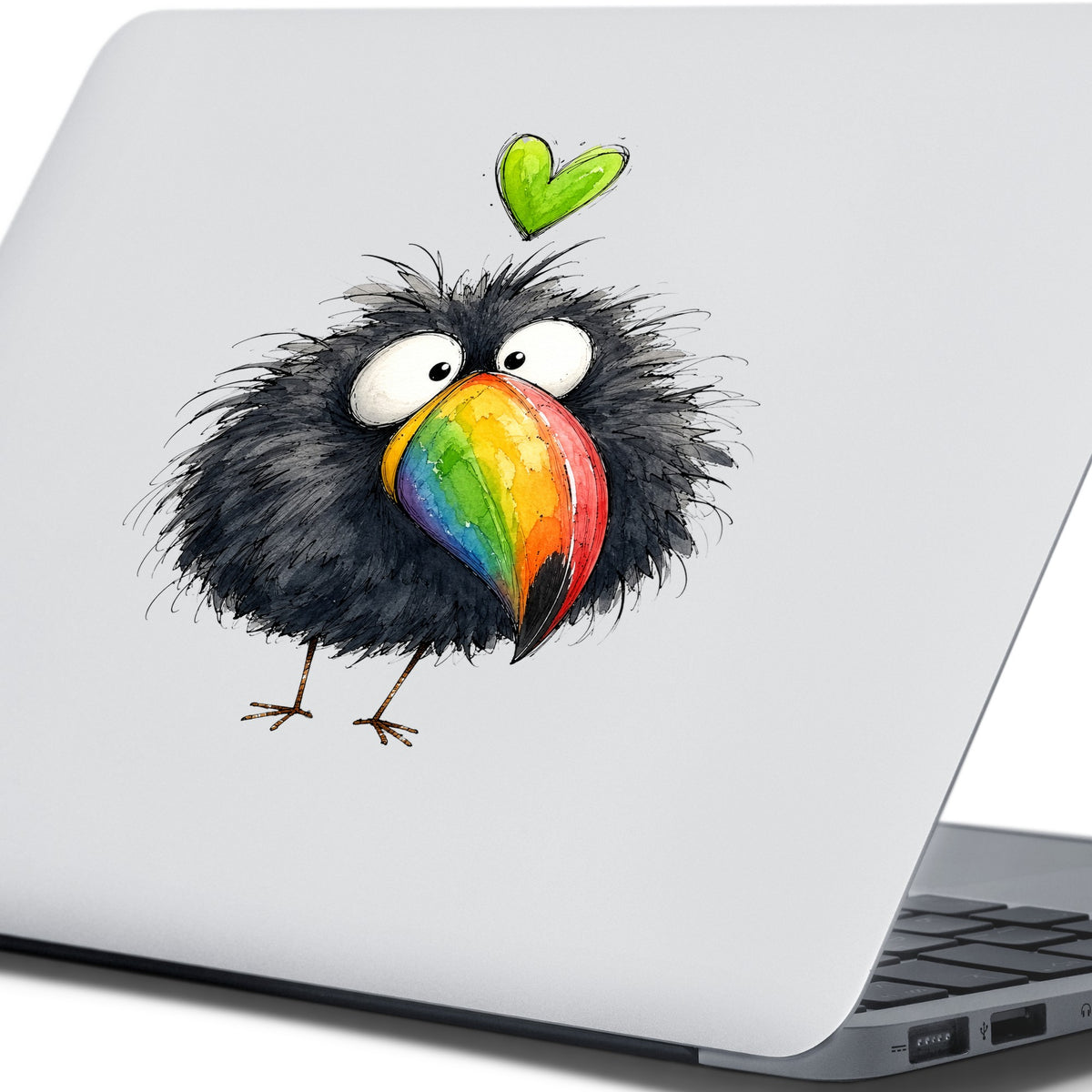 Funny Toucan Rainbow Beak UV DTF sticker applied to the lid of a silver laptop
