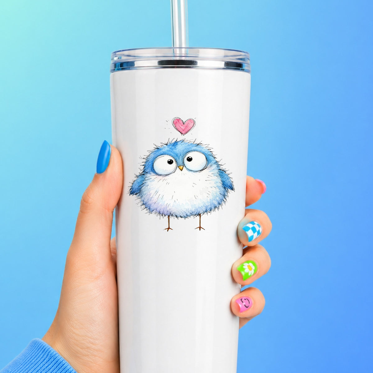 Fluffy Bluebird UV DTF sticker applied to a white straw tumbler on a blue background